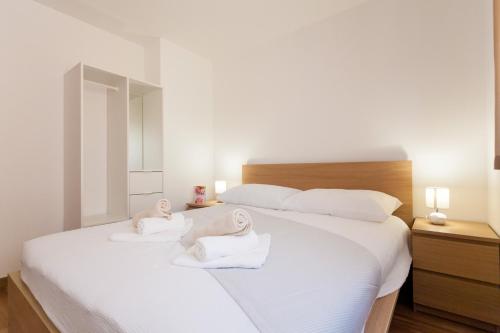 En eller flere senge i et værelse på Apartments Kudec by El-Pi Tours