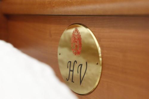 a close up of a brass alarm clock on a drawer at Hotel Venezia in Trento