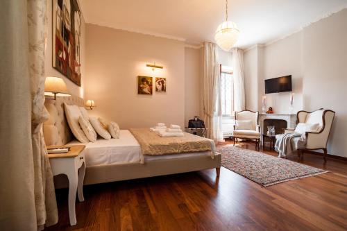 a bedroom with a bed and a living room at Dream House Pompei in Pompei