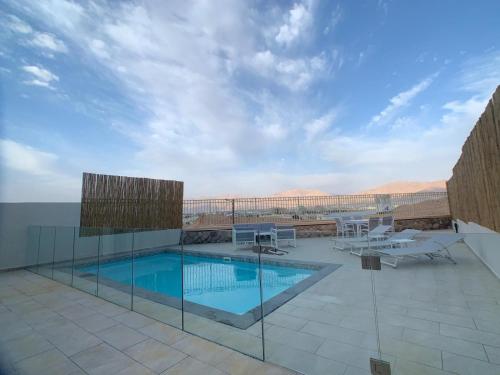 a swimming pool on top of a building at villalis bay view in Eilat