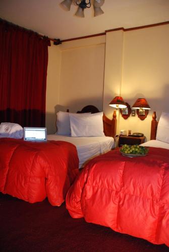 Postel nebo postele na pokoji v ubytování Hotel Casona Colon Inn
