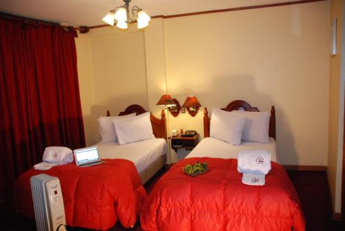 Postel nebo postele na pokoji v ubytování Hotel Casona Colon Inn