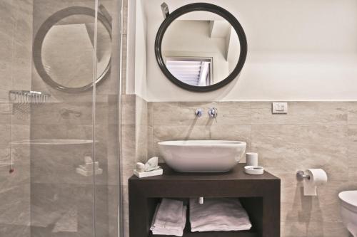 a bathroom with a sink and a mirror at Poggio Baronti B&B in Bagno a Ripoli