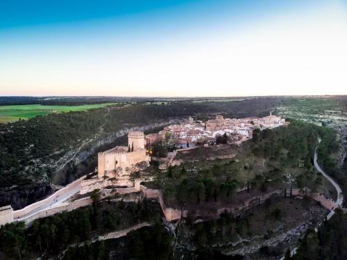 an aerial view of a castle on a cliff at Parador de Alarcón in Alarcón