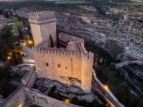 an aerial view of a castle at night at Parador de Alarcón in Alarcón