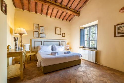 A bed or beds in a room at Pieve Marsina & Borgo Argenina