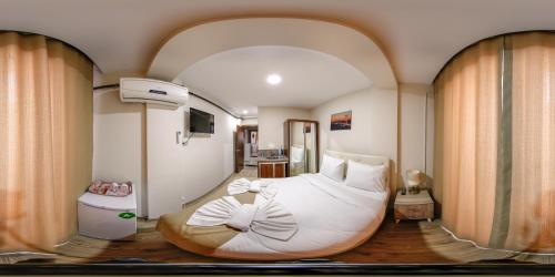 En eller flere senge i et værelse på Reggae Apart Hotel