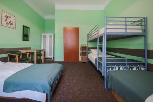 a bedroom with a bunk bed and a table at Two Ducks Hostel in Rome