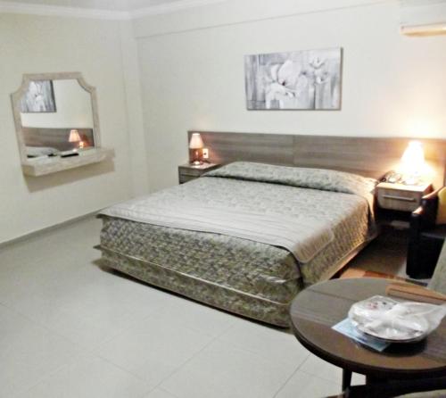 Voodi või voodid majutusasutuse Apart Hotel Acrópolis toas