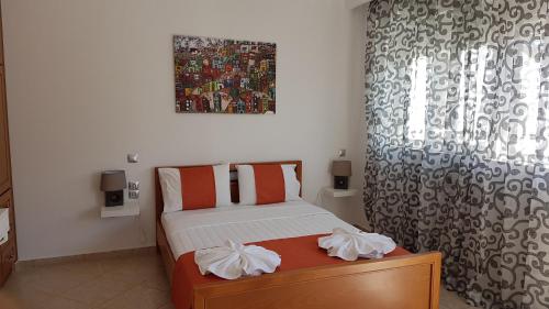 a small bedroom with a bed and a window at The Heart of Kissamos Studios in Kissamos