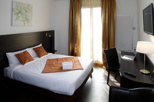 Postel nebo postele na pokoji v ubytování L'EPI HOTEL