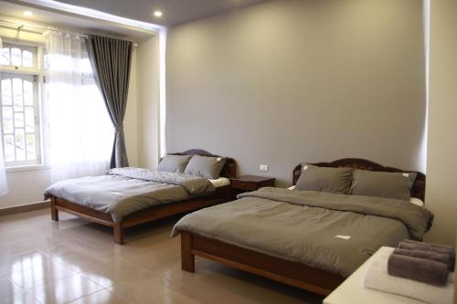 Postel nebo postele na pokoji v ubytování Grey House