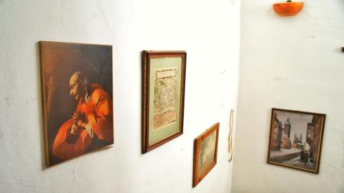 a group of pictures hanging on a wall at Schloss Berg Klösterle in Zedlitzdorf
