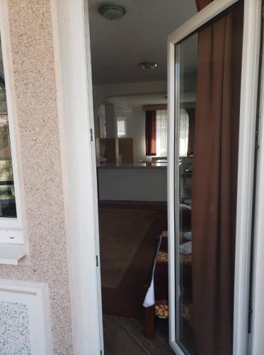 a view of a kitchen through a sliding glass door at Apartmani Ambiente in Plav