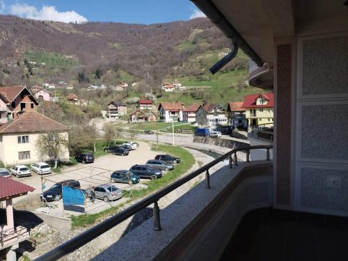 a balcony with a view of a parking lot at Apartmani Ambiente in Plav