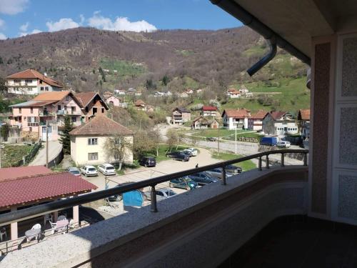 a balcony with a view of a parking lot at Apartmani Ambiente in Plav