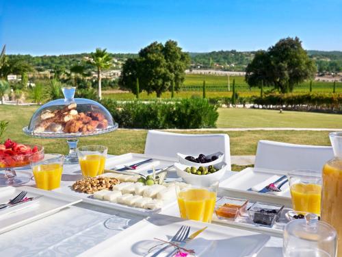 a table with a buffet of food on it at Two Rooms Hotel in Urla