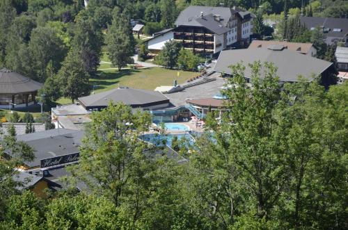 an aerial view of a resort with a pool at Panoramapension Lerchner in Bad Kleinkirchheim