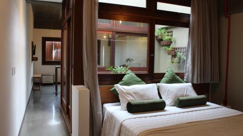 Tempat tidur dalam kamar di Pitaya Apart Hotel
