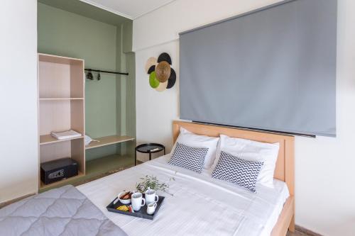 Ένα ή περισσότερα κρεβάτια σε δωμάτιο στο mantinia-apartments