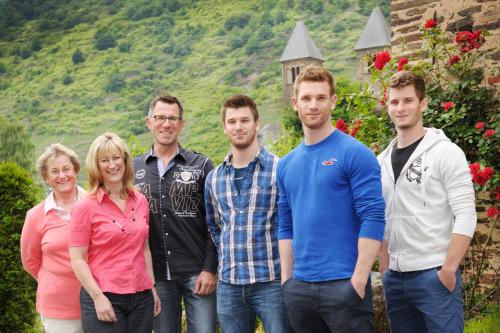 a group of people standing in front of a house at Winneburger Hof in Ernst