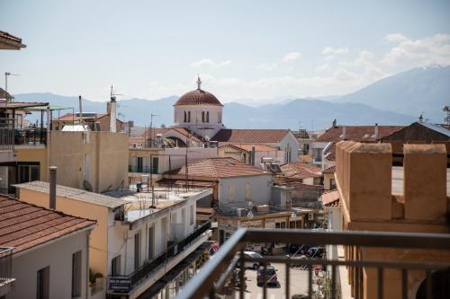 a view of a city with buildings and a church at Casa in Centro in Nafpaktos