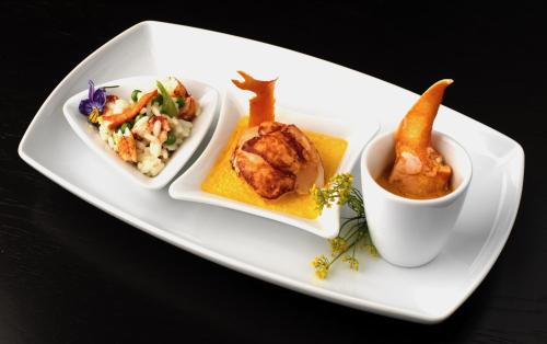 a plate with three different types of food on it at Vaughan Lodge Hotel in Lahinch