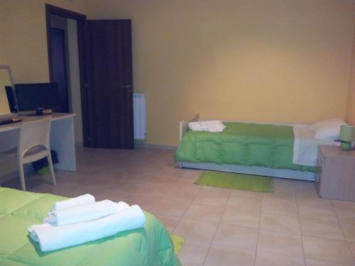 Postel nebo postele na pokoji v ubytování B&B LAVIKA PEDARA