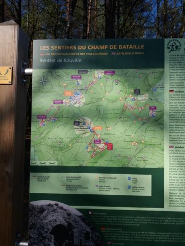 a sign on a wall with a map at Chez Isa et Christophe in Mogeville