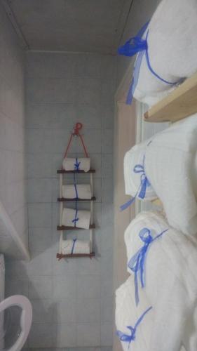 a pile of toilet paper on a shelf in a bathroom at Marinautica Sea Cottage in Sorrento