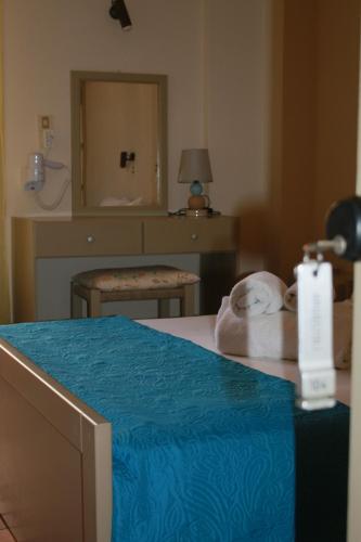 Una cama o camas en una habitación de Argostoli Hotel