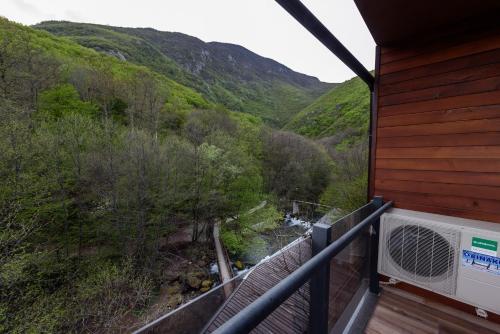 a balcony of a house with a view of a mountain at Resort Ujevara e Drinit in Peje