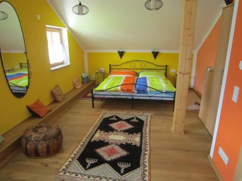 a bedroom with a bed and a large mirror at Haus Bellevue in Obertraun