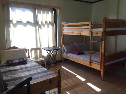 Кровать или кровати в номере Banga-an BnB and Coffee House