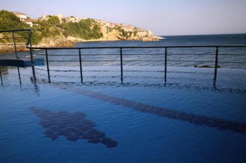 a pool of water with a view of the ocean at Apartments Eneida in Ulcinj