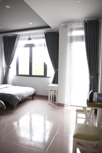 Postel nebo postele na pokoji v ubytování Grey House
