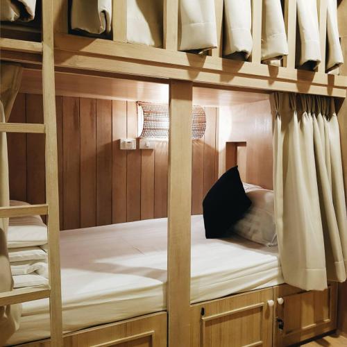 a couple of bunk beds in a room at Amaka Bed and Breakfast in Chiang Mai