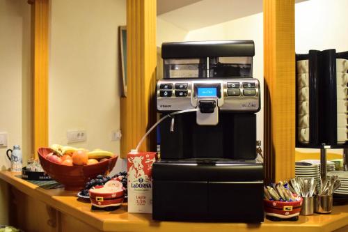 a coffee machine sitting on top of a counter at Vila Seva in Vatra Dornei