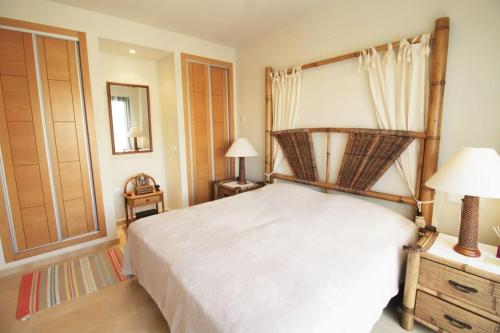 a bedroom with a large bed with a canopy at The Oasis in Fuente Alamo