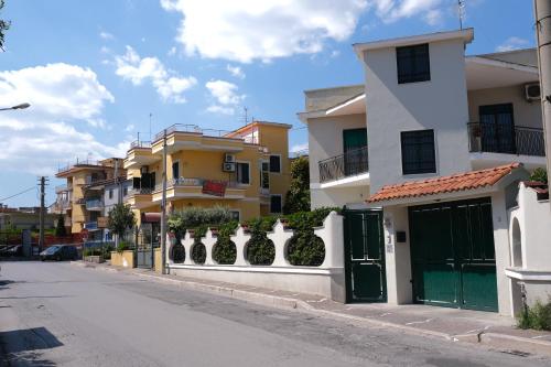 a row of buildings on a city street at Hoa Suites in Aversa
