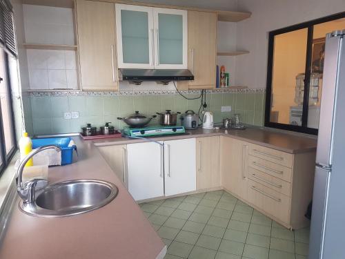 a kitchen with a sink and a counter top at Peter Holiday Home @ Marina Court Condo in Kota Kinabalu