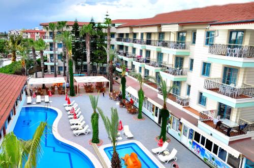 an aerial view of a hotel with a swimming pool at Cinar Family Suite Hotel in Side