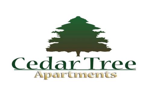 ein Logo eines Baumes mit den Worten „Zedernholzapartments“ in der Unterkunft CedarTREE Prishtina in Pristina