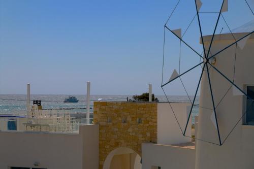 a view of the ocean from a house with a building at Blue Diamond Beach Villas in Paphos City