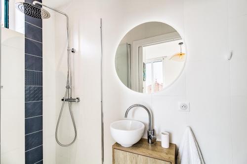 a bathroom with a sink and a mirror at NEW ! SEA VIEW Design + Balcony 203 in Villefranche-sur-Mer