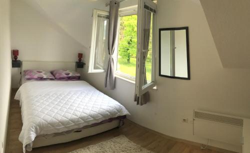 a bedroom with a bed and a window at Apartment Iva in Trebinje