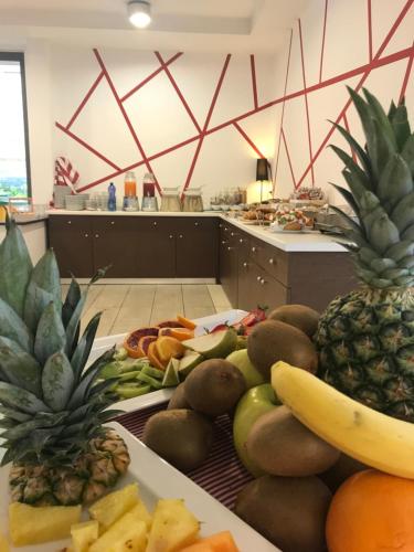 a bunch of fruits and vegetables on a table at Hotel Royal in San Benedetto del Tronto