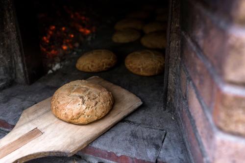 a loaf of bread on a cutting board in an oven at Sperveri Boutique Hotel in Rhodes Town