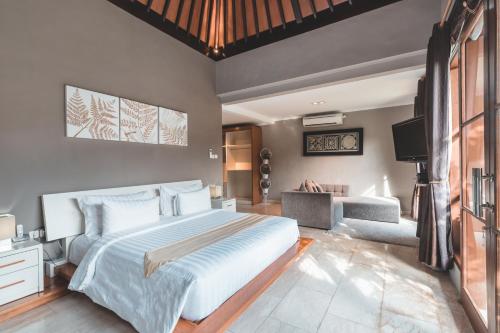 Vuode tai vuoteita majoituspaikassa Dura Villas Canggu Bali