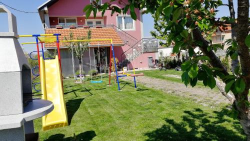 a playground in the yard of a house at Apartments "Predah kod Baraća" in Niš